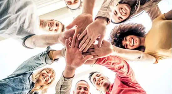 A group of people coming together, symbolizing unity and support at drug and alcohol treatment centers in Kentucky, fostering recovery in a positive environment.