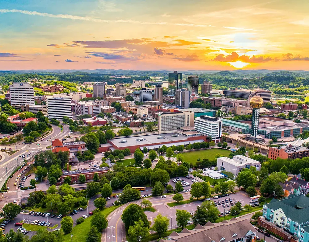 An aerial view of a vibrant cityscape in Tennessee at sunset, symbolizing hope and recovery offered by drug and alcohol treatment centers in Tennessee.