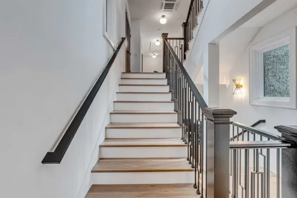 A bright and modern staircase leading to private spaces at a drug and alcohol detox center in Nashville, designed to provide comfort and a welcoming atmosphere for recovery.
