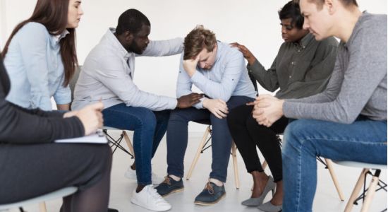 A woman in a therapy session discussing her journey towards recovery, highlighting personalized care at drug and alcohol treatment centers in Kentucky.