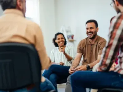 A group therapy session where individuals share stories and support each other in a welcoming environment, part of drug and alcohol treatment centers in Tennessee.