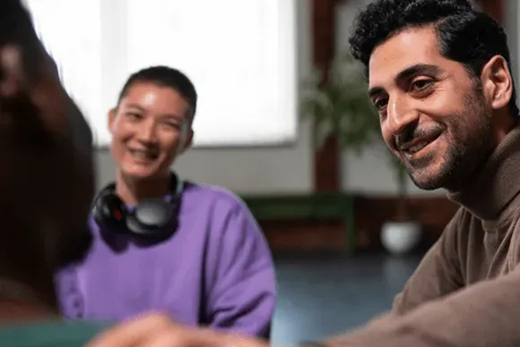 A counselor offering personalized support in a group therapy session at a drug and alcohol rehab center in Louisville, KY, fostering trust and understanding.