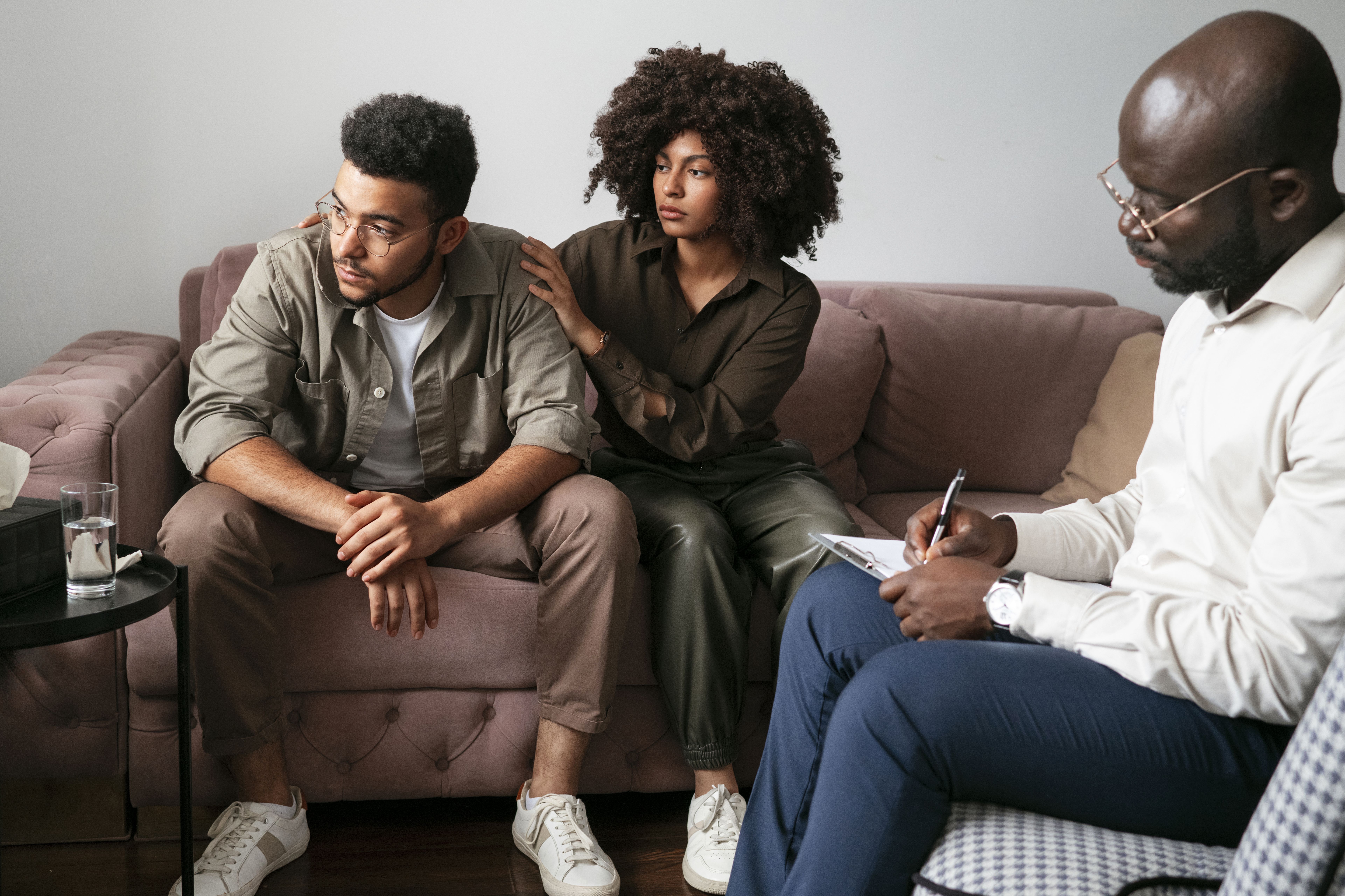 A compassionate medical professional attentively helping a distressed individual, showcasing the personalized care provided at a drug and alcohol rehab center in Louisville, KY.
